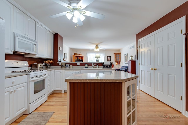 1538 Queen Ann Ln, Gurnee, IL 60031 - kitchen featuring white appliances, ceiling fan, a kitchen island, light wood finished floors, and light countertops