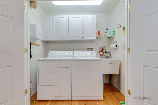 1538 Queen Ann Ln, Gurnee, IL 60031 - laundry room with washing machine and dryer, cabinet space, and light wood-style floors