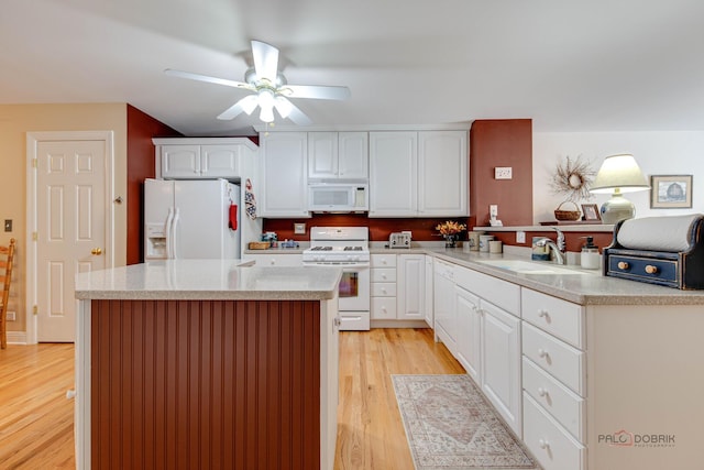 1538 Queen Ann Ln, Gurnee, IL 60031 - kitchen featuring white appliances, a ceiling fan, light wood finished floors, and white cabinets