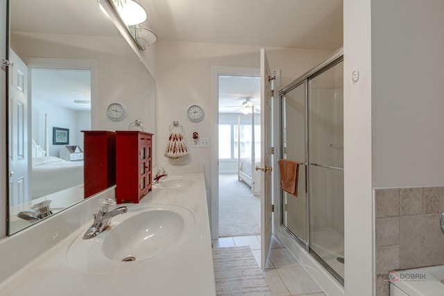 1538 Queen Ann Ln, Gurnee, IL 60031 - ensuite bathroom featuring double vanity, a shower stall, ceiling fan, and tile patterned floors