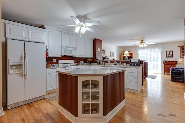 1538 Queen Ann Ln, Gurnee, IL 60031 - kitchen with white appliances, a ceiling fan, a peninsula, light wood-style flooring, and a kitchen island