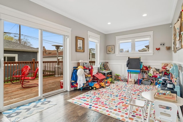 4130 N Mango Ave, Chicago, IL 60634 - playroom with a wainscoted wall, crown molding, wood finished floors, and recessed lighting