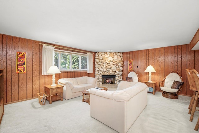 15138 S 75th Ct Unit 0, Orland Park, IL 60462 - living area featuring wood walls, light colored carpet, and a stone fireplace