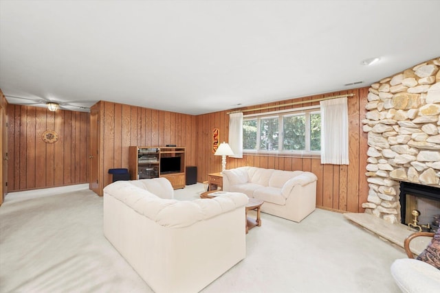 15138 S 75th Ct Unit 0, Orland Park, IL 60462 - living area with wood walls, a stone fireplace, and light carpet