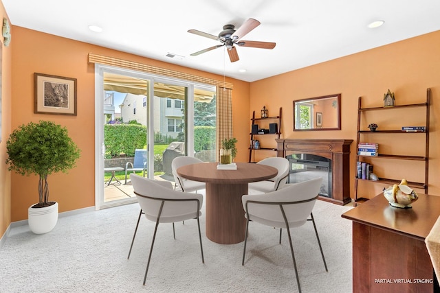 3251 Ravinia Cir, Mundelein, IL 60060 - dining space featuring a glass covered fireplace, ceiling fan, and recessed lighting