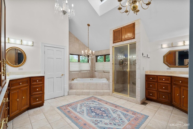 51 Chippewa Dr, Oswego, IL 60543 - full bathroom with a chandelier, high vaulted ceiling, vanity, tile patterned flooring, and a bath