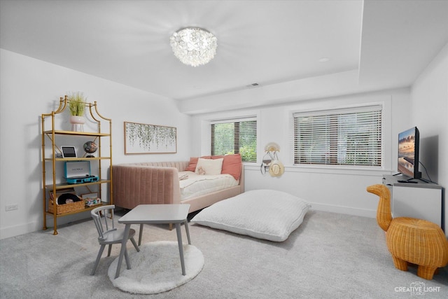 51 Chippewa Dr, Oswego, IL 60543 - carpeted bedroom featuring baseboards and a chandelier