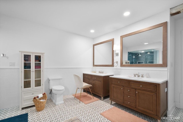 51 Chippewa Dr, Oswego, IL 60543 - full bath with vanity, a shower stall, tile walls, a wainscoted wall, and recessed lighting