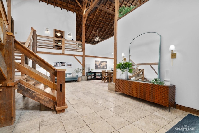 51 Chippewa Dr, Oswego, IL 60543 - stairs featuring high vaulted ceiling and tile patterned floors