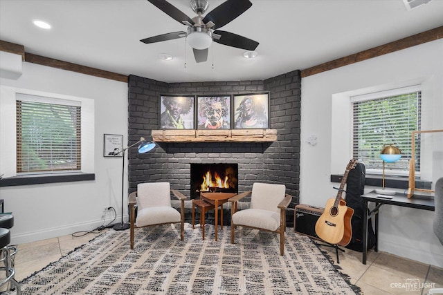 51 Chippewa Dr, Oswego, IL 60543 - sitting room featuring tile patterned flooring, healthy amount of natural light, a brick fireplace, and a ceiling fan