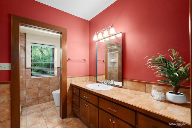 51 Chippewa Dr, Oswego, IL 60543 - full bath with tile walls, vanity, tile patterned floors, and wainscoting