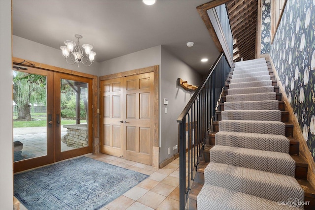51 Chippewa Dr, Oswego, IL 60543 - entryway with french doors, stairs, a chandelier, light tile patterned flooring, and recessed lighting