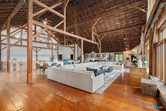 51 Chippewa Dr, Oswego, IL 60543 - living area featuring high vaulted ceiling, hardwood / wood-style flooring, and a fireplace