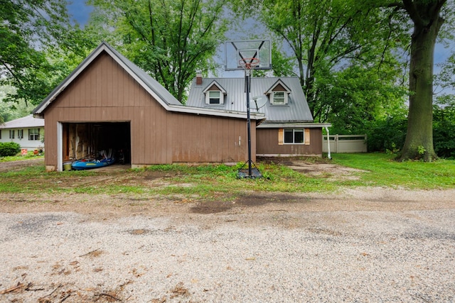17366 Walden Rd, Hudson, IL 61748 - view of front facade with a metal roof and a detached garage