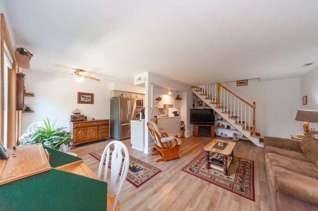 1232 Cove Dr, Prospect Heights, IL 60070 - living area featuring light wood-style floors, stairway, a ceiling fan, and a fireplace