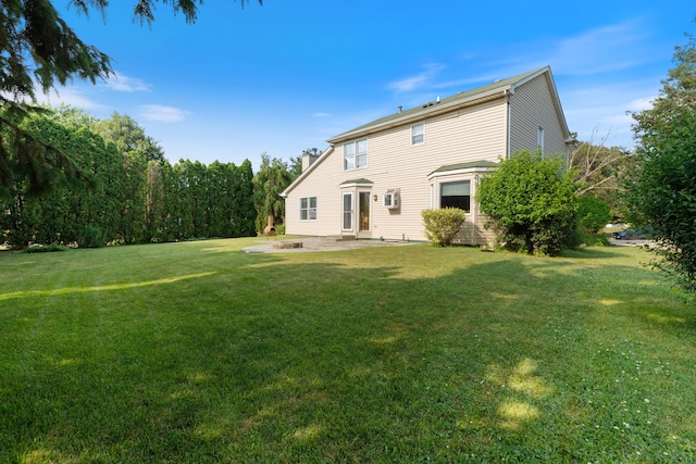 255 Ironbark Ct, Bolingbrook, IL 60440 - back of property featuring a patio area, a yard, an outdoor fire pit, and a chimney