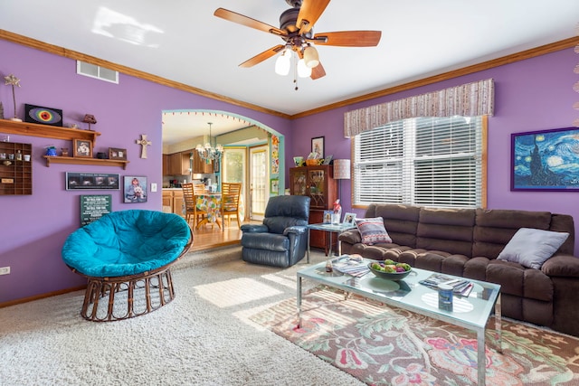 255 Ironbark Ct, Bolingbrook, IL 60440 - carpeted living area with a chandelier, crown molding, ceiling fan, and arched walkways
