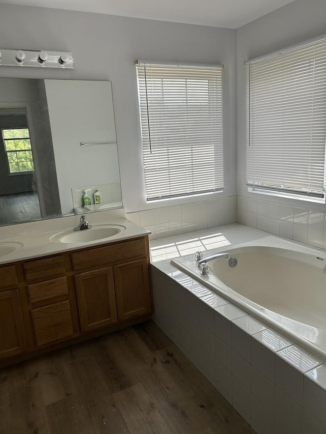 161 Gregory M Sears Dr, Gilberts, IL 60136 - bathroom featuring a bath, double vanity, and wood finished floors