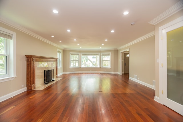 2900 W Birchwood Ave, Chicago, IL 60645 - unfurnished living room with crown molding, plenty of natural light, a fireplace, wood finished floors, and recessed lighting