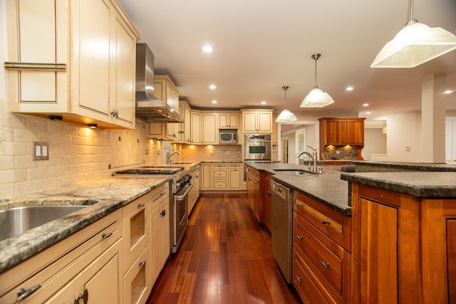 2900 W Birchwood Ave, Chicago, IL 60645 - kitchen featuring wall chimney range hood, cream cabinetry, appliances with stainless steel finishes, dark stone counters, and dark wood finished floors