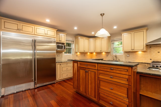 2900 W Birchwood Ave, Chicago, IL 60645 - kitchen featuring stainless steel appliances, cream cabinets, dark wood-style floors, tasteful backsplash, and recessed lighting