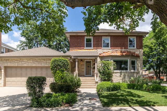 2900 W Birchwood Ave, Chicago, IL 60645 - american foursquare style home with stone siding, an attached garage, concrete driveway, a front lawn, and a shingled roof