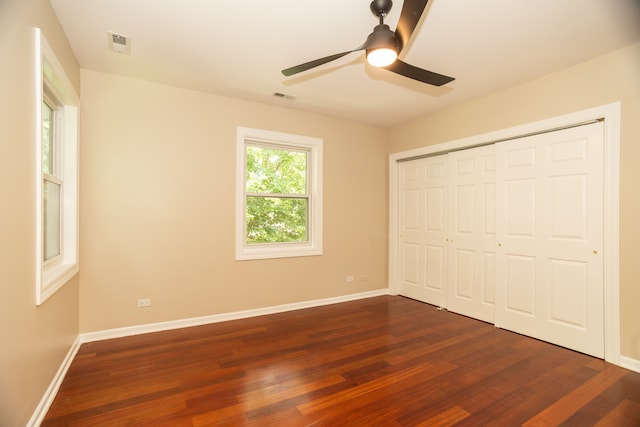 2900 W Birchwood Ave, Chicago, IL 60645 - unfurnished bedroom featuring dark wood-style flooring, a closet, and a ceiling fan