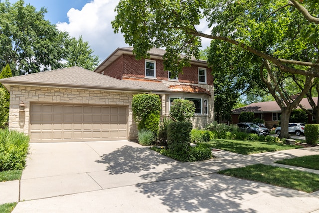 2900 W Birchwood Ave, Chicago, IL 60645 - view of front of home with stone siding, an attached garage, driveway, and roof with shingles