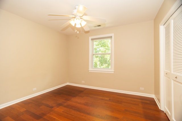 2900 W Birchwood Ave, Chicago, IL 60645 - unfurnished bedroom with a closet, dark wood finished floors, and ceiling fan