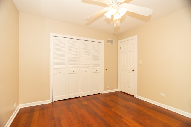 2900 W Birchwood Ave, Chicago, IL 60645 - unfurnished bedroom with dark wood-style flooring, a closet, and a ceiling fan