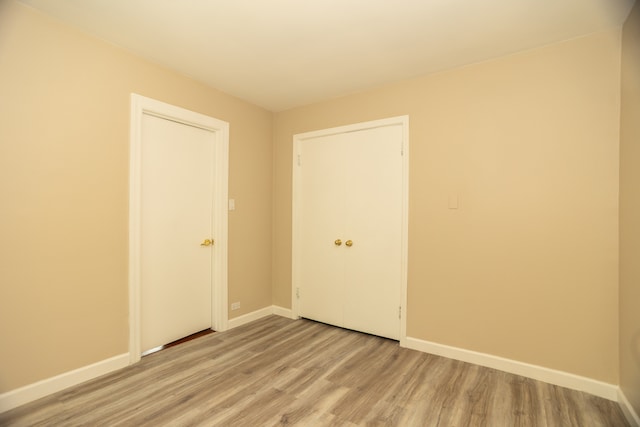 2900 W Birchwood Ave, Chicago, IL 60645 - unfurnished bedroom with light wood-type flooring and baseboards