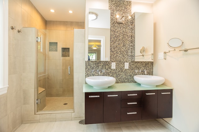 2900 W Birchwood Ave, Chicago, IL 60645 - bathroom with a stall shower, double vanity, backsplash, and tile patterned flooring