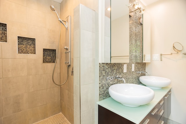2900 W Birchwood Ave, Chicago, IL 60645 - full bathroom featuring tiled shower, double vanity, decorative backsplash, and tile walls