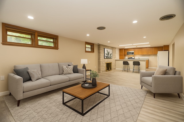 2900 W Birchwood Ave, Chicago, IL 60645 - living room with light wood-style floors, recessed lighting, and a large fireplace