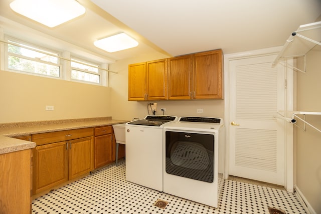 2900 W Birchwood Ave, Chicago, IL 60645 - washroom featuring cabinet space, washing machine and clothes dryer, and light flooring