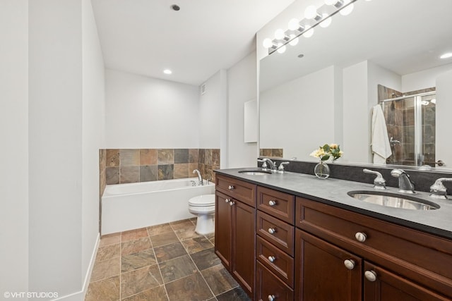 200 W Grand Ave Unit 1803, Chicago, IL 60654 - bathroom featuring double vanity, a garden tub, stone finish flooring, a shower stall, and recessed lighting
