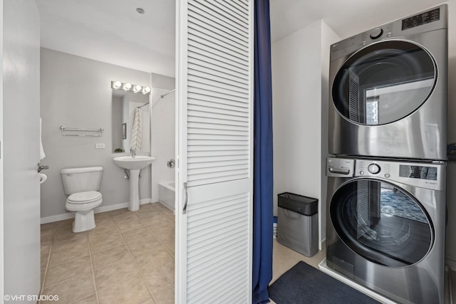 200 W Grand Ave Unit 1803, Chicago, IL 60654 - washroom featuring stacked washer / dryer and tile patterned floors