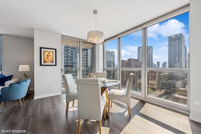 200 W Grand Ave Unit 1803, Chicago, IL 60654 - dining area with dark wood finished floors, a chandelier, a skyline view, and floor to ceiling windows