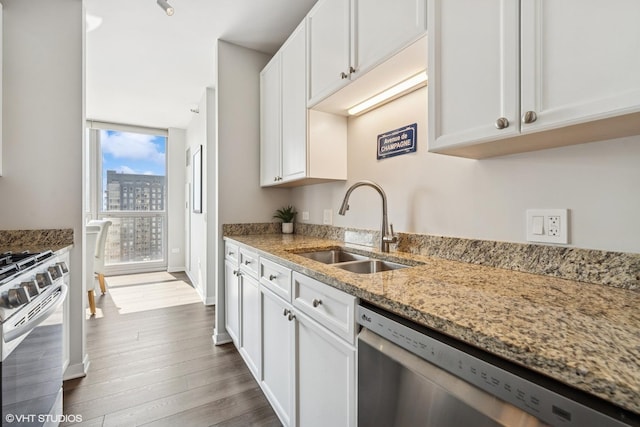 200 W Grand Ave Unit 1803, Chicago, IL 60654 - kitchen with appliances with stainless steel finishes, white cabinetry, light stone countertops, and dark wood-style flooring