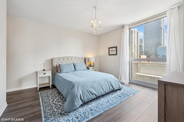 200 W Grand Ave Unit 1803, Chicago, IL 60654 - bedroom featuring wood finished floors, a chandelier, and a view of city