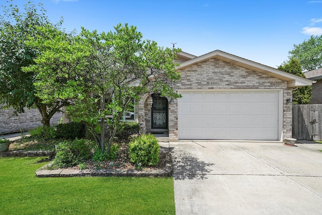 8410 S 78th Ave, Bridgeview, IL 60455 - view of front of home featuring driveway, a garage, and brick siding