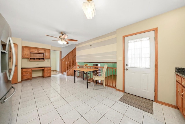 8410 S 78th Ave, Bridgeview, IL 60455 - kitchen with stainless steel refrigerator with ice dispenser, a ceiling fan, open shelves, built in desk, and light tile patterned floors