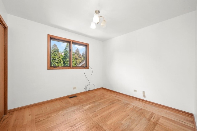 8410 S 78th Ave, Bridgeview, IL 60455 - spare room featuring light wood-style floors and baseboards