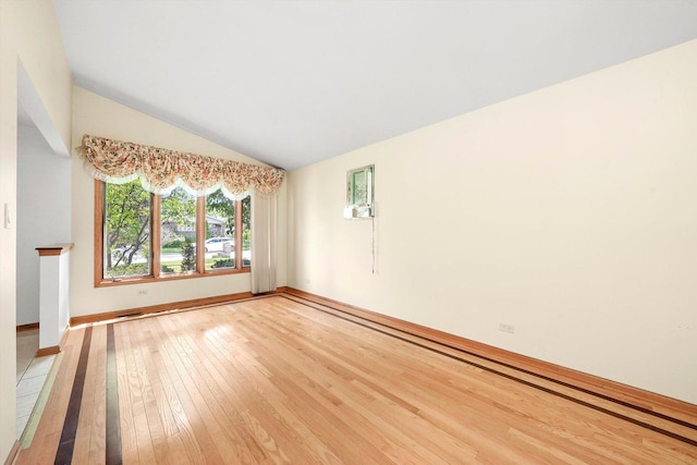 8410 S 78th Ave, Bridgeview, IL 60455 - empty room featuring light wood-style flooring and vaulted ceiling
