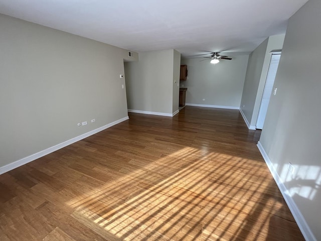 6156 Knoll Way Dr Unit 101, Willowbrook, IL 60527 - empty room featuring ceiling fan and dark wood-style flooring