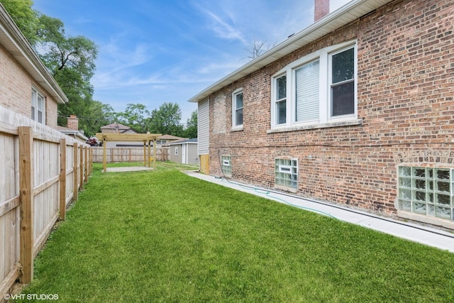 12330 S Perry Ave, Chicago, IL 60628 - fenced backyard with a storage unit