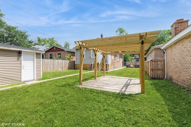 12330 S Perry Ave, Chicago, IL 60628 - fenced backyard featuring an outdoor structure and a patio area