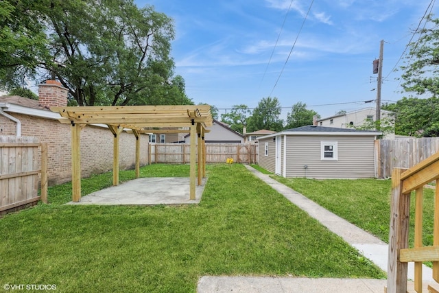 12330 S Perry Ave, Chicago, IL 60628 - fenced backyard featuring a patio area and an outdoor structure