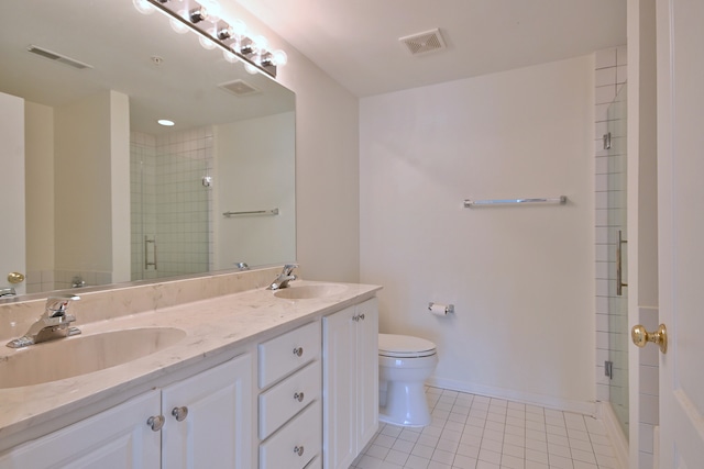 111 N Larch Ave Unit 206, Elmhurst, IL 60126 - bathroom featuring tile patterned floors, double vanity, and tiled shower