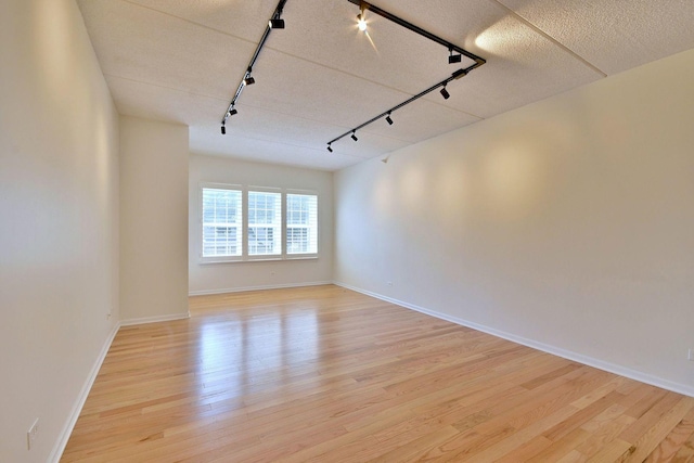 111 N Larch Ave Unit 206, Elmhurst, IL 60126 - empty room with track lighting and light wood-style flooring